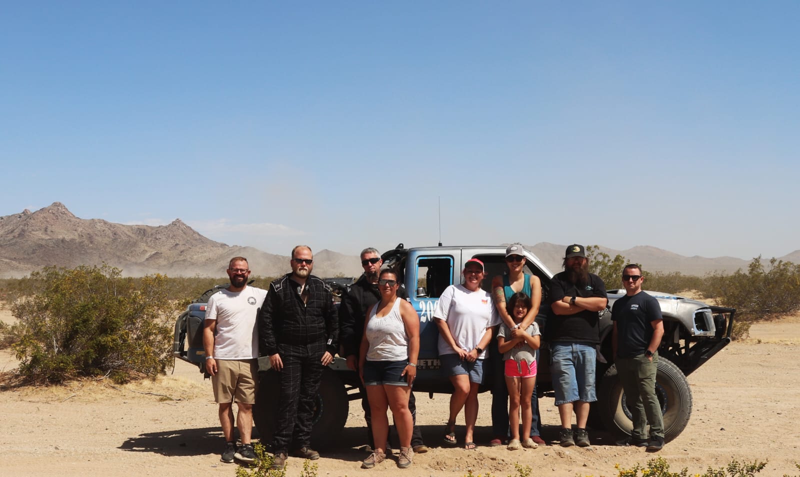 The desert racing team gathered together for a group photo